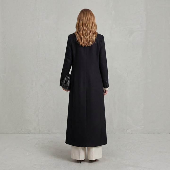 Women's elegant maxi double-breasted trench coat, essential for classic cold weather style.