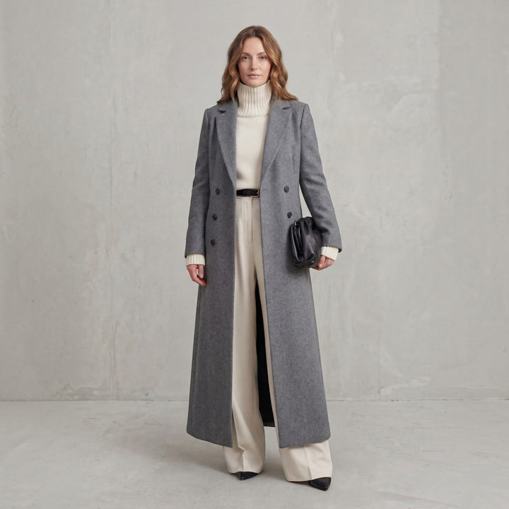 Elegant women's maxi coat, double-breasted, perfect classic style for cold weather.
