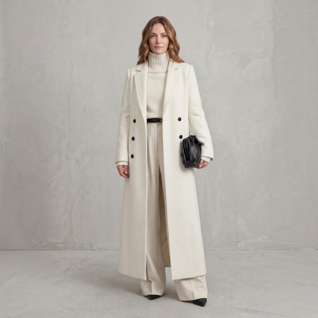 Elegant women's maxi trench coat, double-breasted design for classic fall outerwear.