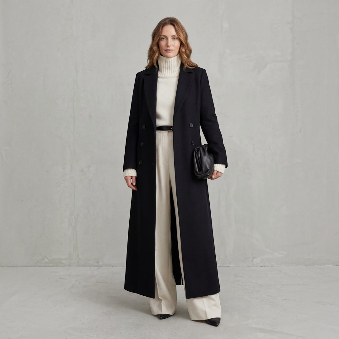 Classic women's double-breasted maxi trench coat, ideal elegant outerwear for fall.