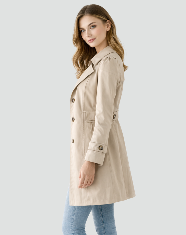 Sophisticated women's tailored trench coat. Classic mid-length jacket, ideal spring or fall outerwear for an elegant style.