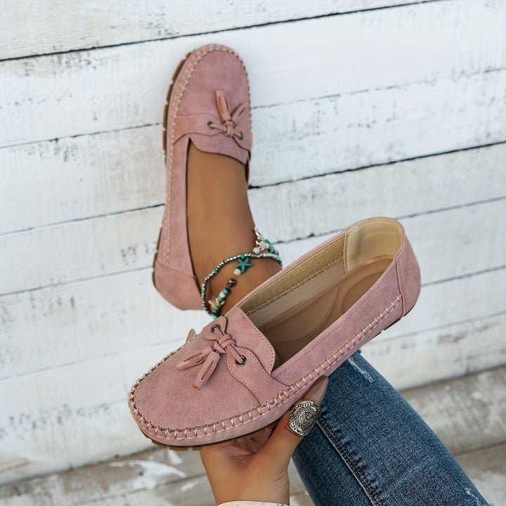 Stylish women's classic tassel loafers, elegant for office or casual fashion. Comfortable slip-on everyday shoes.