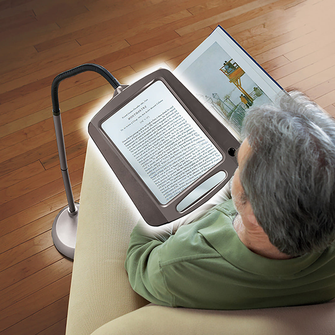Ergonomic ClearView LED task lamp with illuminated magnifier, great for intricate detailed work on your desk.