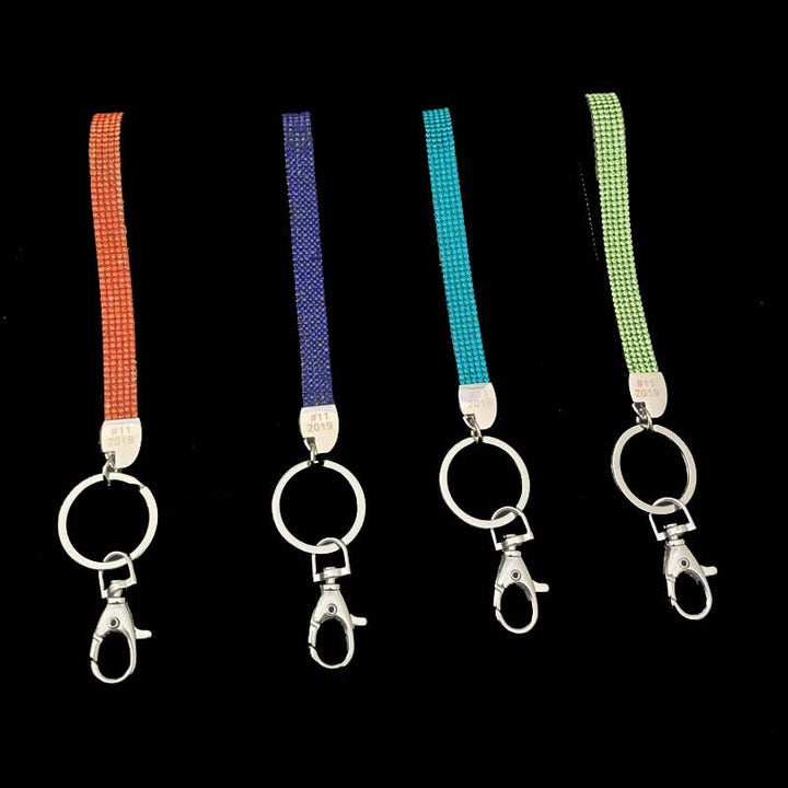 Crystal-encrusted keychain, a glittering fashion accessory for keys and bags. Adds sparkle.