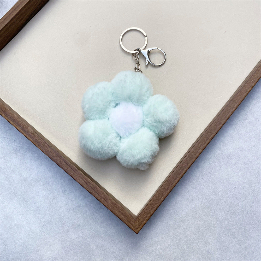 Unique floral plush key accessory, soft to the touch, perfect decorative bag charm.