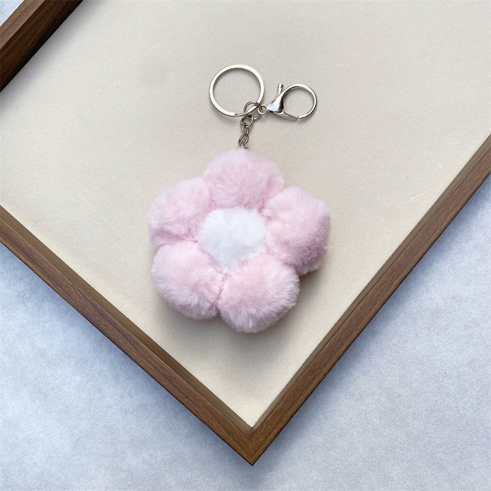 Unisex plush flower charm, a whimsical and soft accessory to brighten bags or keys.