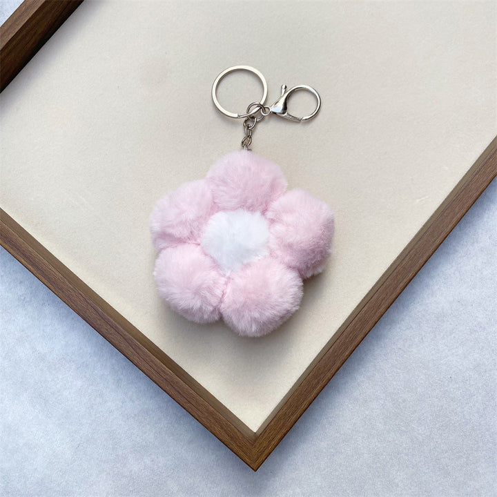 Unisex plush flower charm, a whimsical and soft accessory to brighten bags or keys.