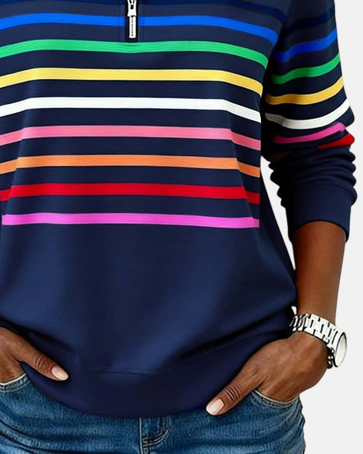 Relaxed fit striped long sleeve pullover for women, featuring a practical quarter zip.