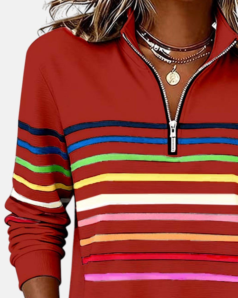 Woman posing in a women's striped quarter zip jumper, highlighting its modern design.