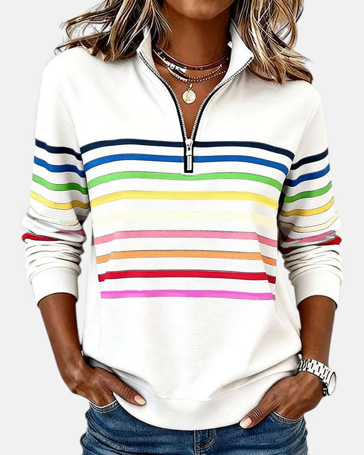 Vibrant women's striped quarter zip jumper, ideal for comfy and stylish autumn outfits.
