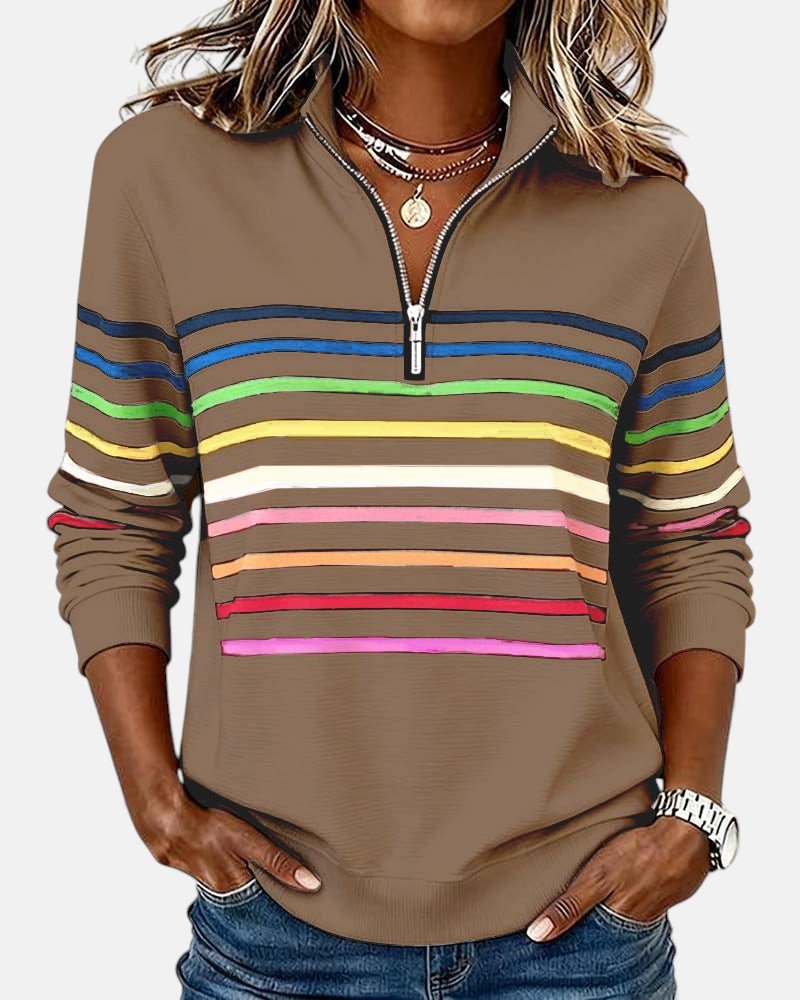 Side view of a woman wearing a comfortable striped jumper, showcasing its relaxed fit.
