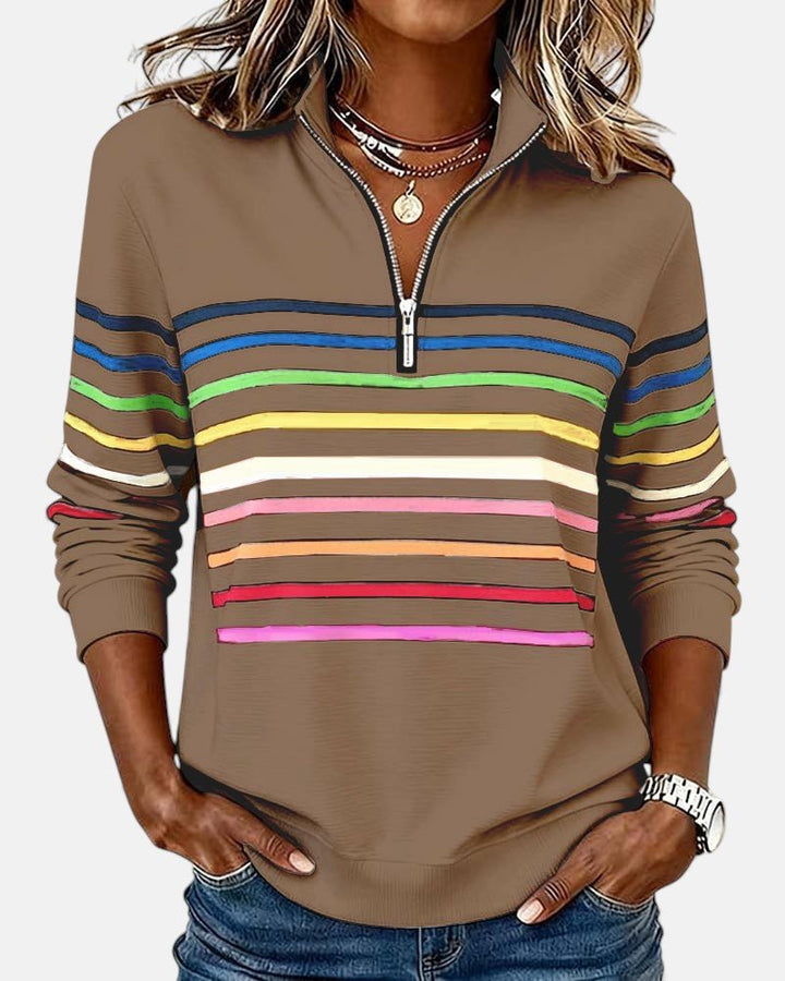 Side view of a woman wearing a comfortable striped jumper, showcasing its relaxed fit.