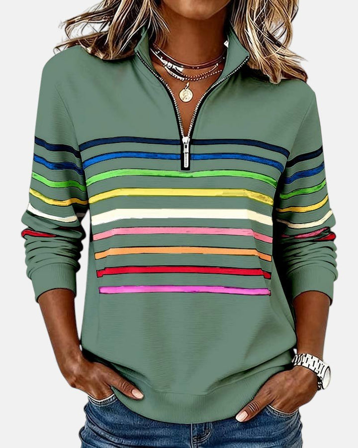 Stylish women's quarter zip pullover with bold stripes, a versatile long sleeve top.