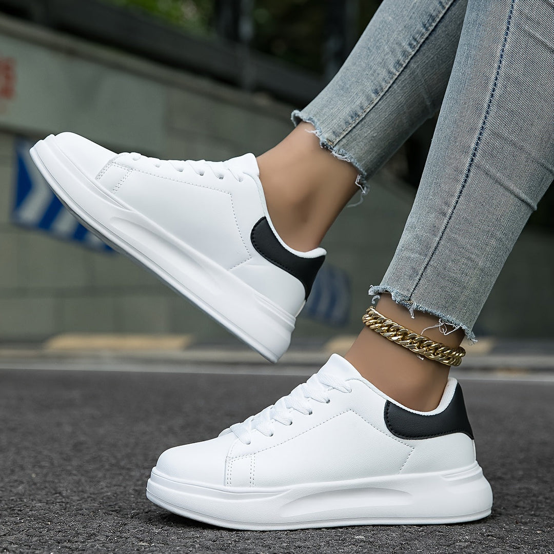 Side view of new white women's casual sneakers, perfect for fashion-forward everyday footwear.