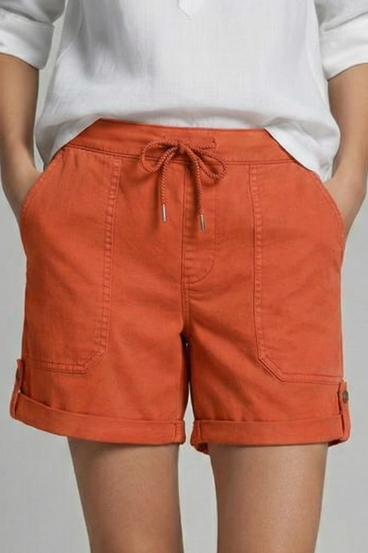 Stack of colorful women's casual drawstring pocket shorts for versatile summer wear.