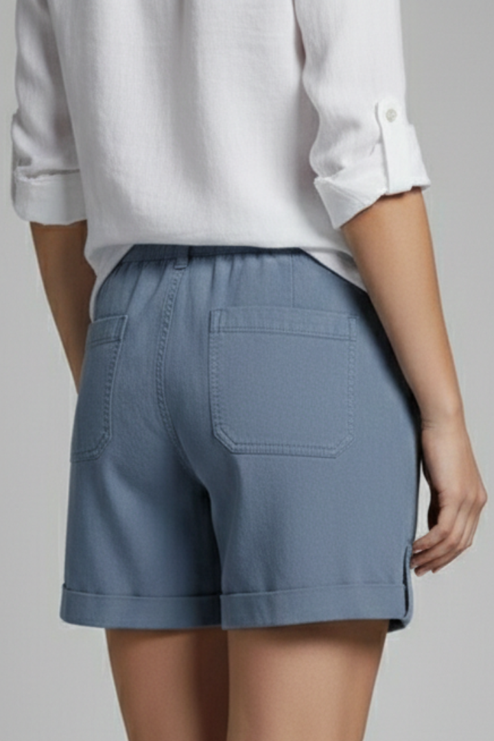 Model wearing women's casual drawstring pocket shorts in a relaxed summer outfit.