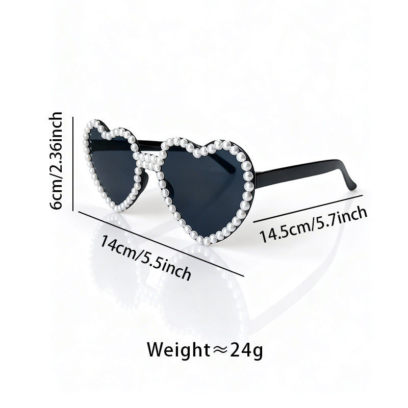Stylish woman wearing Heart Pearl Accent Sunglasses outdoors, UV protection, summer style.