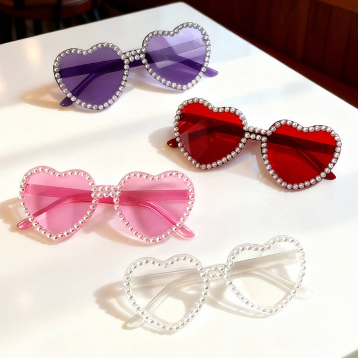 Pair of chic Heart Pearl Accent Sunglasses, black frame, white pearls, trendy accessory.