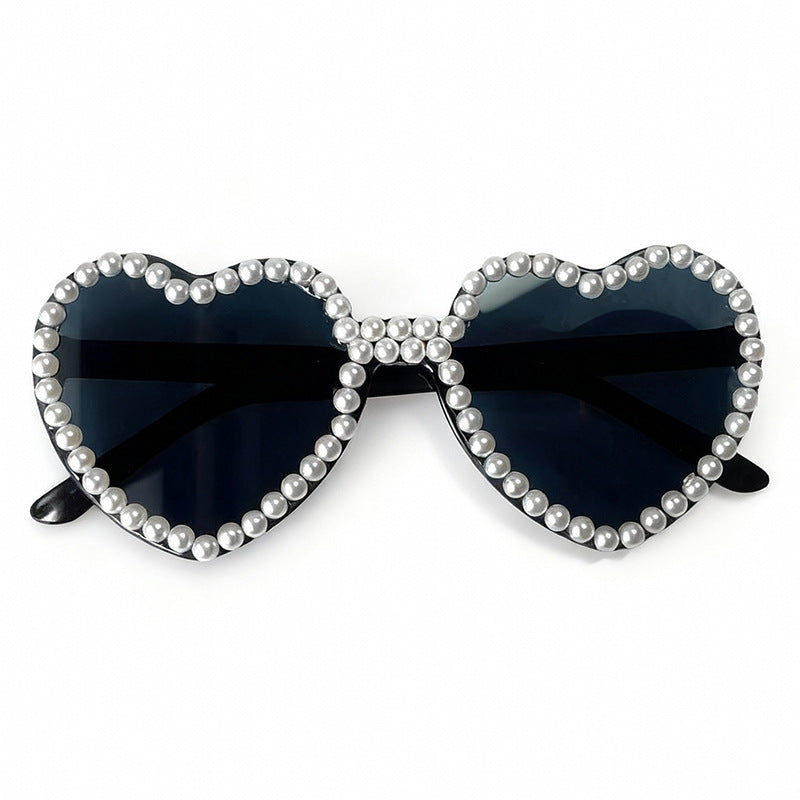 Heart-shaped women's sunglasses with elegant pearl accents, fashion eyewear.