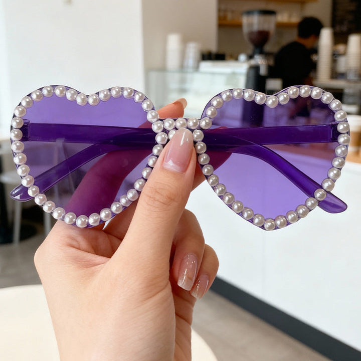 Close-up of pearl details on the frame of Women's Heart Sunglasses, chic fashion.