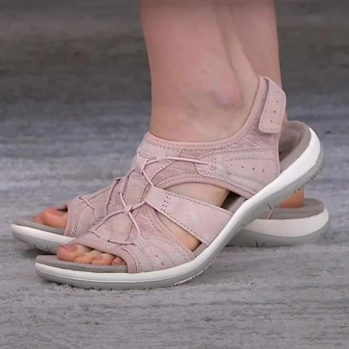 Side view of a women's comfort sandal, highlighting the supportive footbed and adjustable strap for summer walking.