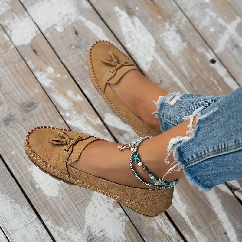 Women's elegant slip-on shoes: black orthopedic tassel loafers for foot health.