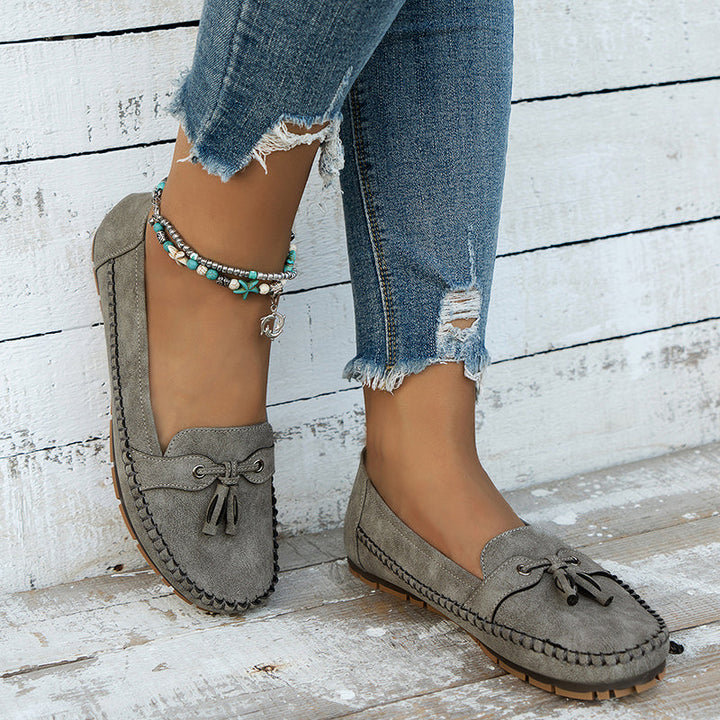 Detailed shot of the tassels on women's orthopedic comfort loafers.