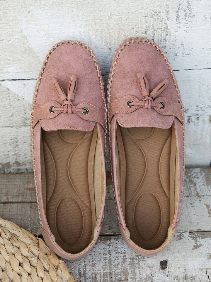 Women's fashion comfort footwear: black orthopedic tassel loafers with arch support.