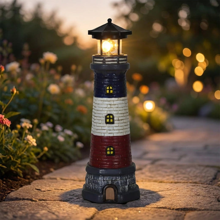 Coastal Lighthouse solar garden light with rotating LED beacon, perfect for outdoor patio decor.