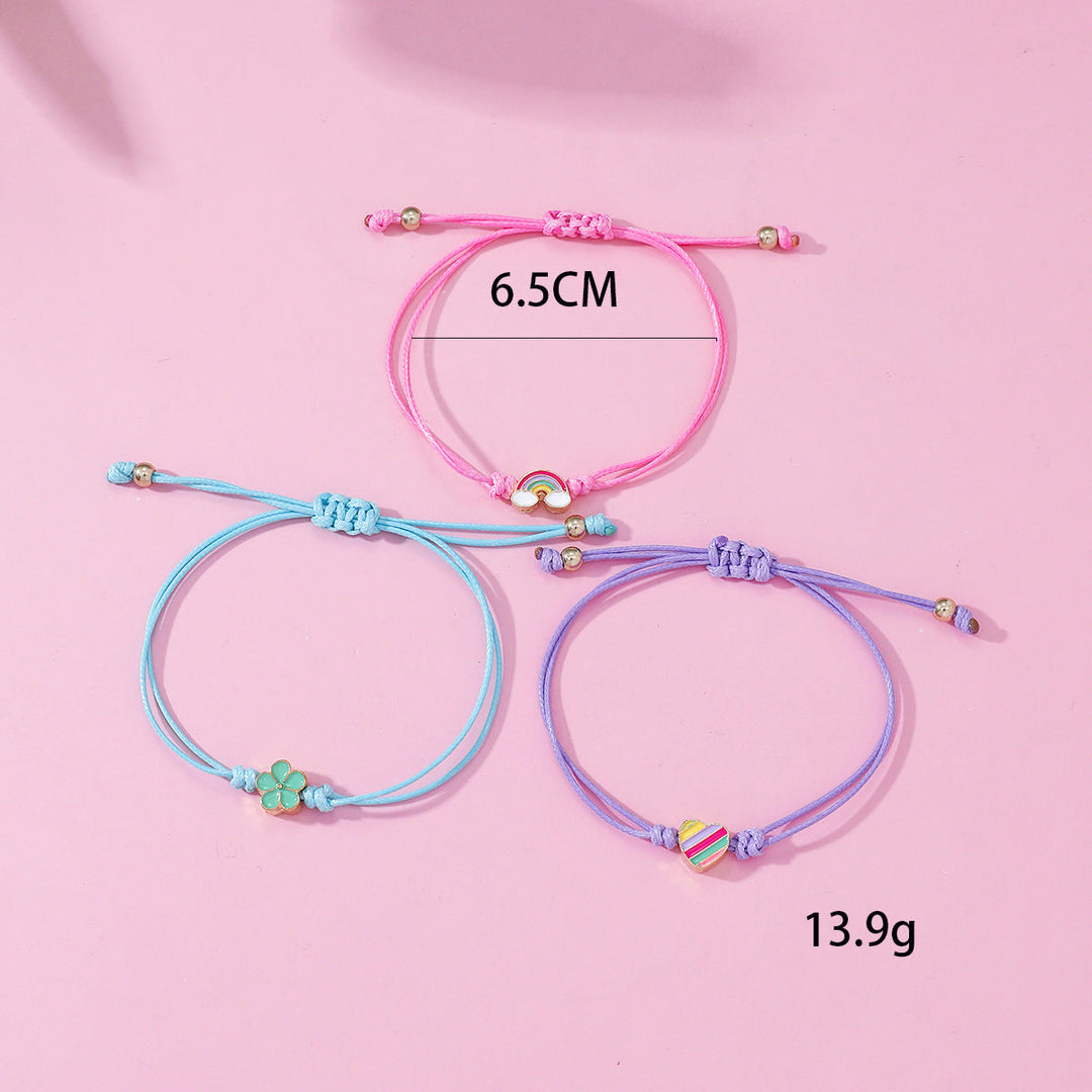 Vibrant 4-piece friendship bracelet set with heart, rainbow, and flower charms; adjustable for women.