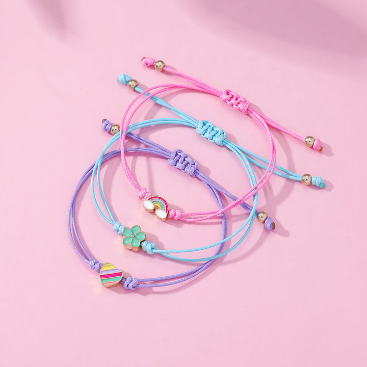 Colorful 4-piece adjustable friendship bracelet set for women, with charming designs. Ideal friendship gift.