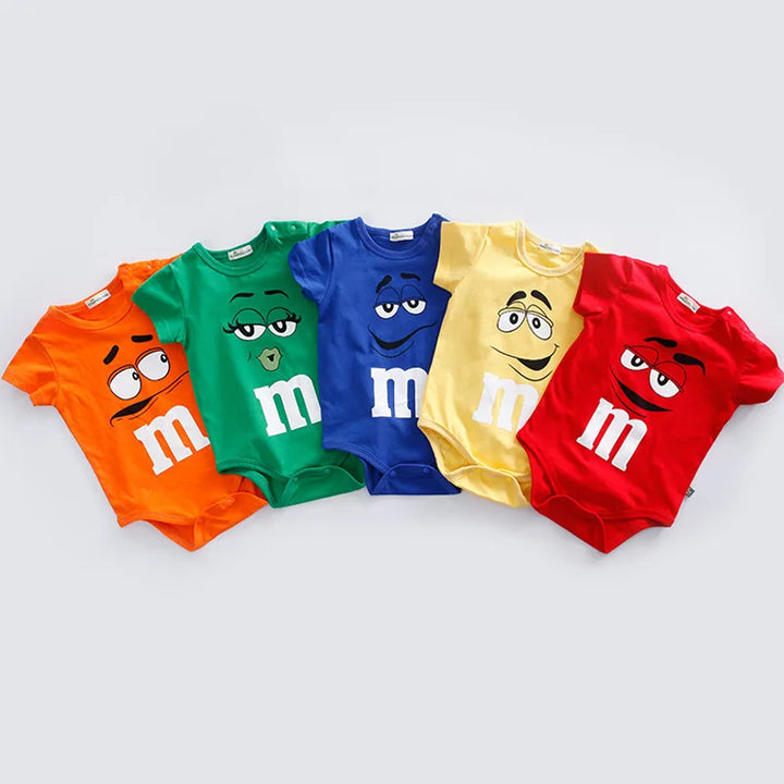 Comfy colorful M&M faces baby romper. Soft short sleeve infant clothing, perfect for playful summer casual wear.