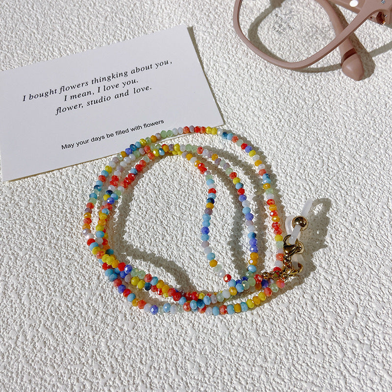 Colorful bead glasses chain, stylish eyewear holder. Secure, fashionable accessory for spectacles.