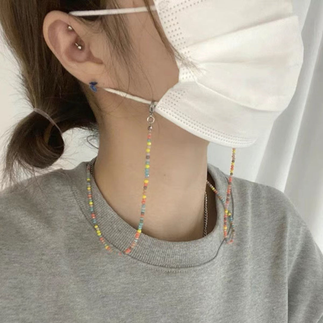 Vibrant beaded glasses holder chain. Secure, stylish eyewear accessory for spectacles. Multi-colored design.