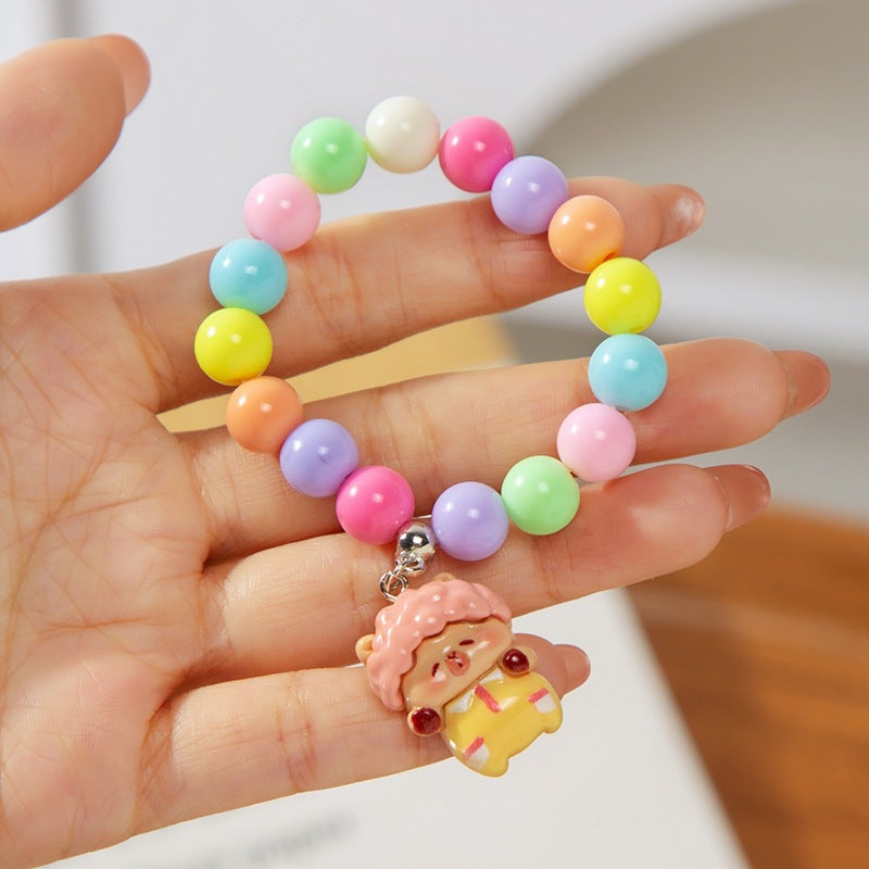 Assorted colorful plastic bead charm bracelets, adjustable for children's wrists; fun kids jewelry.