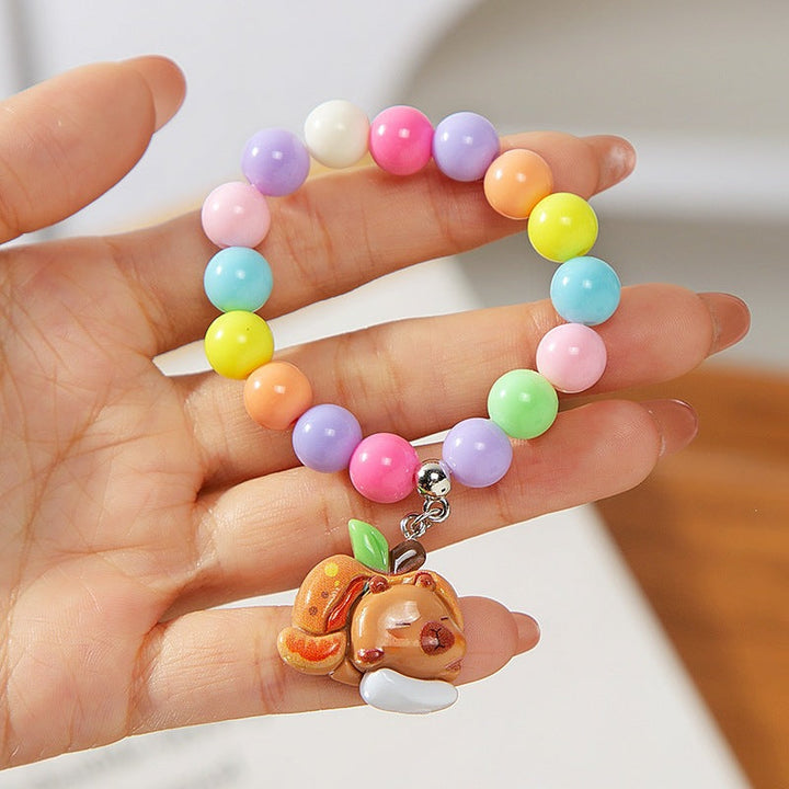 Durable plastic bead charm bracelet, colorful and adjustable for active kids; great gift idea.