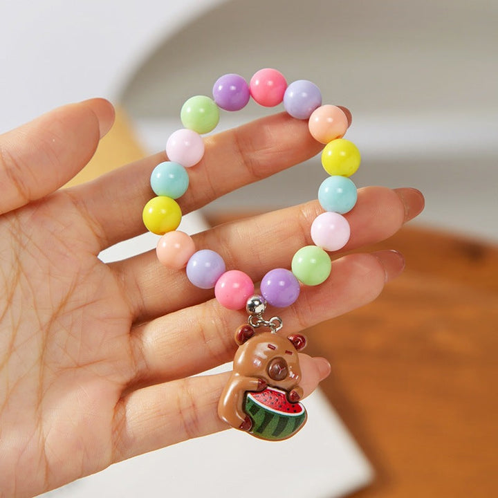 Kids' colorful charm bracelet, perfect for imaginative play & everyday wear; adjustable design.