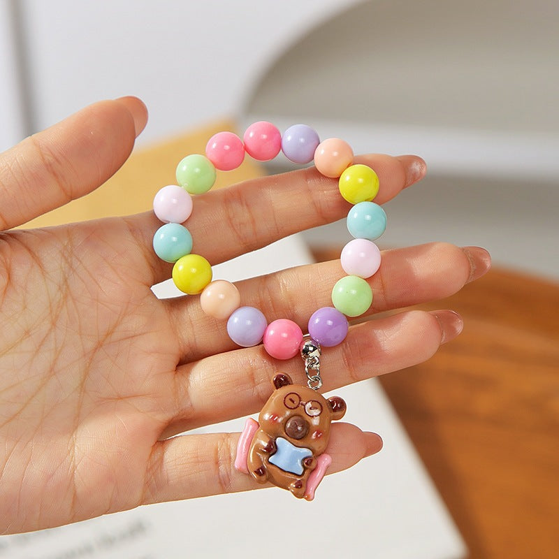 Vibrant adjustable children's charm bracelet, plastic animal beads, playful kids' accessory.