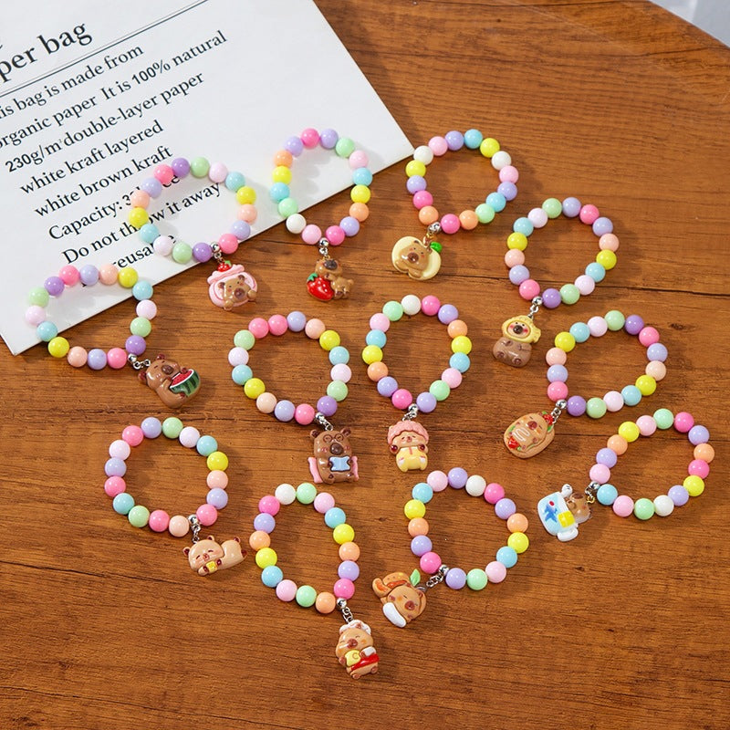 Adjustable kids' colorful charm bracelet, vibrant plastic beads & animal charms; perfect gift.
