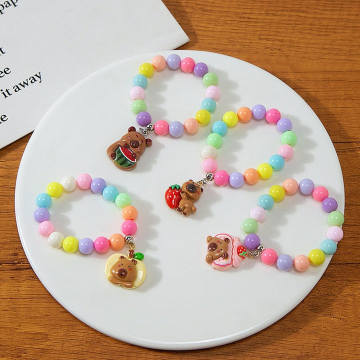 Playful children's plastic bead charm bracelet, vibrant colors & durable kids jewelry accessory.
