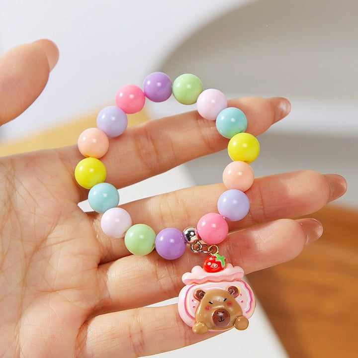 Vibrant, colorful children's charm bracelet with assorted plastic beads & cute animal figures.
