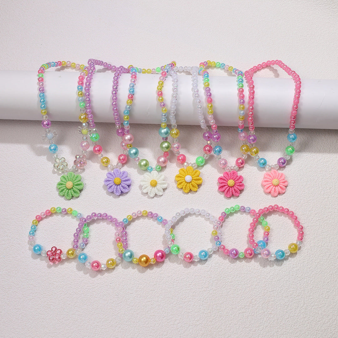 Vibrant multi-colored flower pendant necklace and matching beaded bracelet set for girls.