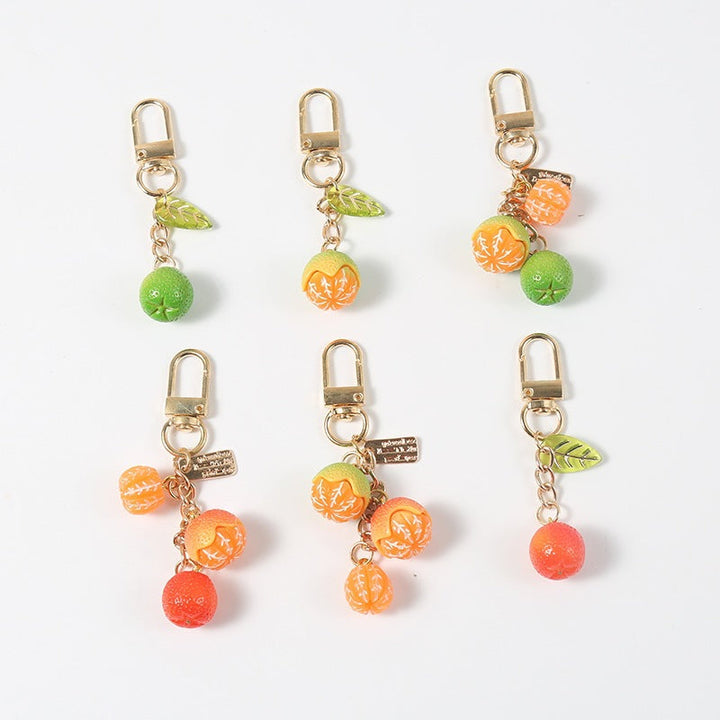 Colorful fruity keychain, perfect bag charm for keys or purse. Playful fashion accessory, great gift idea.