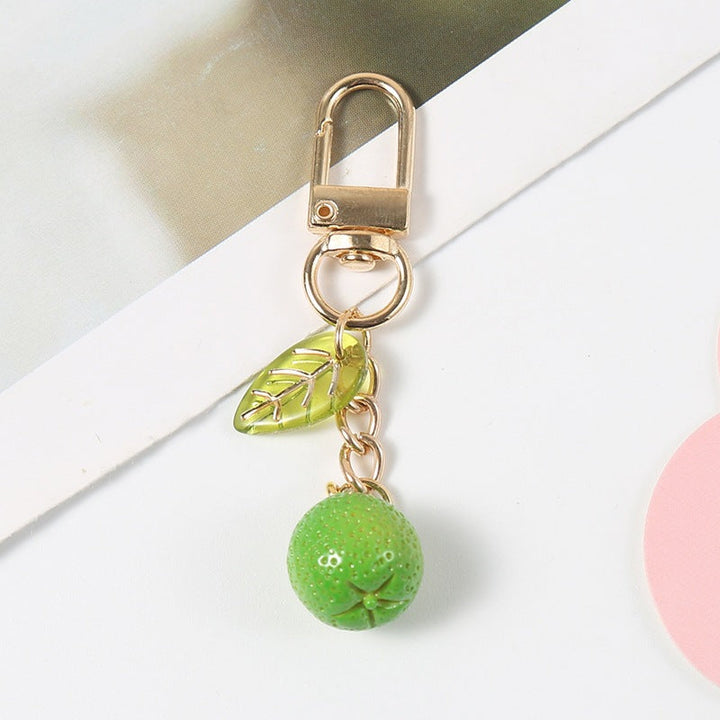 Playful fruity bag charm, a durable keychain and key holder. Colorful fashion accessory for purses.