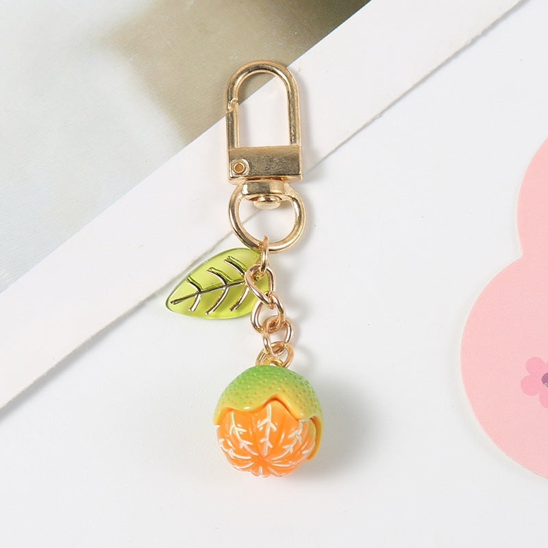 Trendy fruity keychain, perfect as a bag charm or key holder. Durable, colorful, and playful.