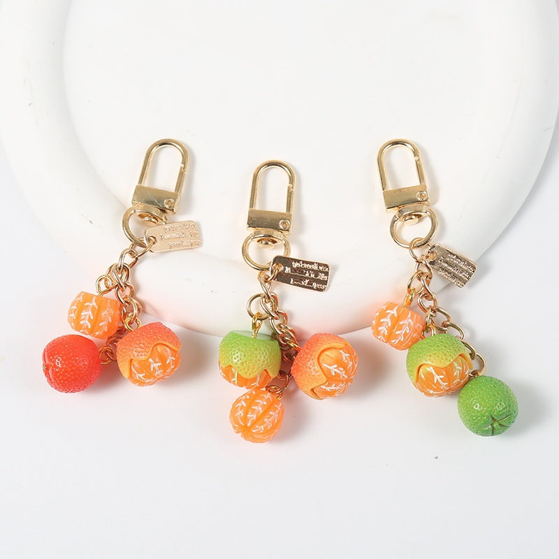 Playful fruity bag charm keychain, a colorful fashion accessory for any key holder or handbag.