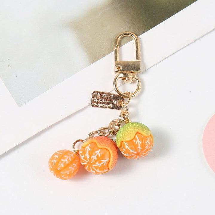 Unique fruity design keychain, a playful and vibrant purse accessory and key holder. Great gift.