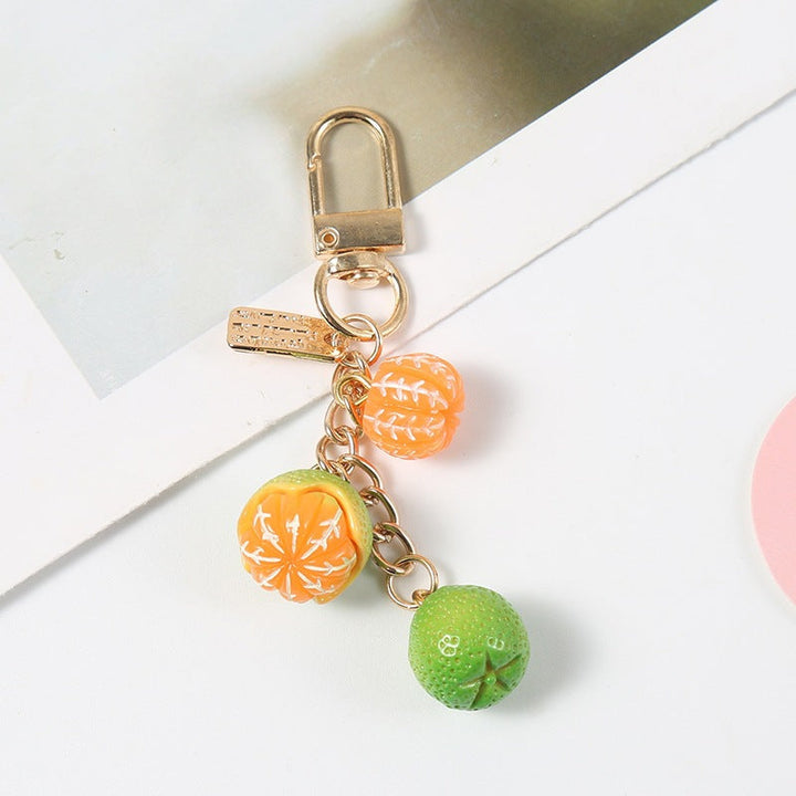Stylish fruity keychain, ideal for keys or as a bag charm. Colorful, durable, and playful fashion accessory.