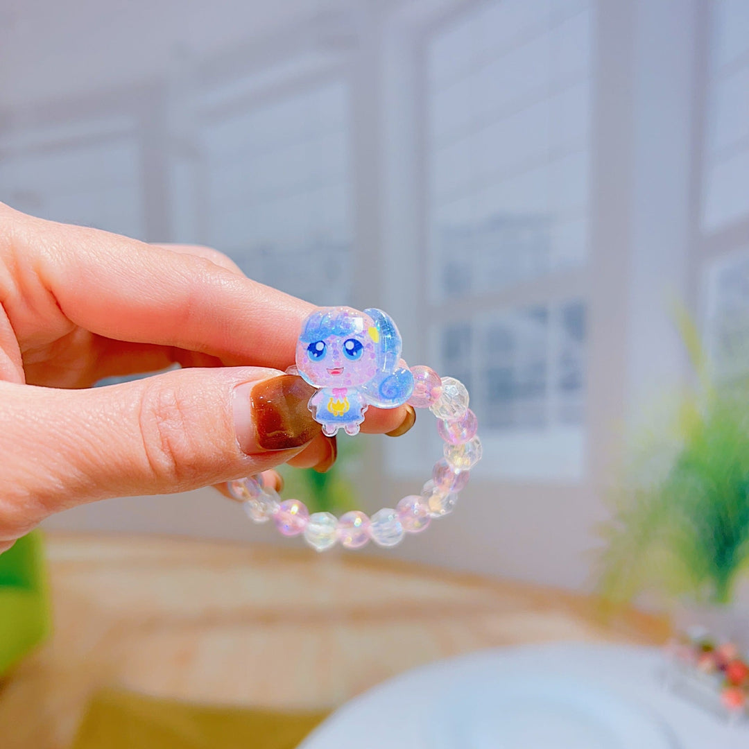 Adorable cartoon charm bracelet for girls, adjustable elastic band, a fun and unique gift for kids.