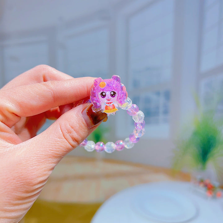 Playful girls' bracelet with multiple cartoon charms and beads, an adjustable and comfortable accessory.
